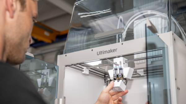 Close-up of UltiMaker S6 dual-extrusion print head with active nozzle lifting system