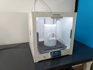 3D printed protective case for glass labware in a modern lab environment, printed using UltiMaker S6 and PLA material.