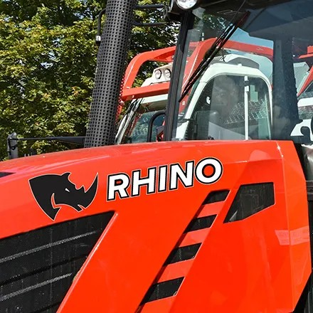 Clear high-tack vinyl graphic printed on Jessup TenaciousTac CLR 1CRAE applied to a red RHINO tractor door