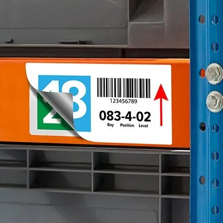 High-tack vinyl label printed on Jessup TenaciousTac 1CRG applied to a red fuel container handle and lid