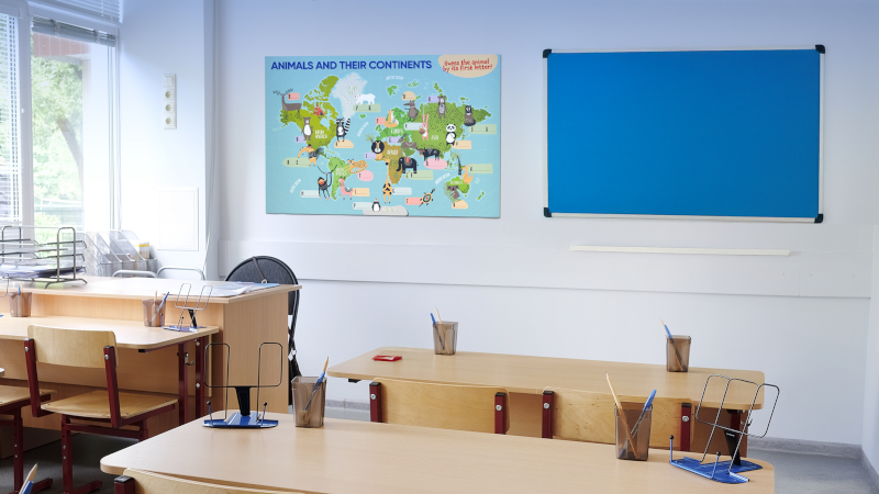 Classroom wall poster showing animals and their continents map