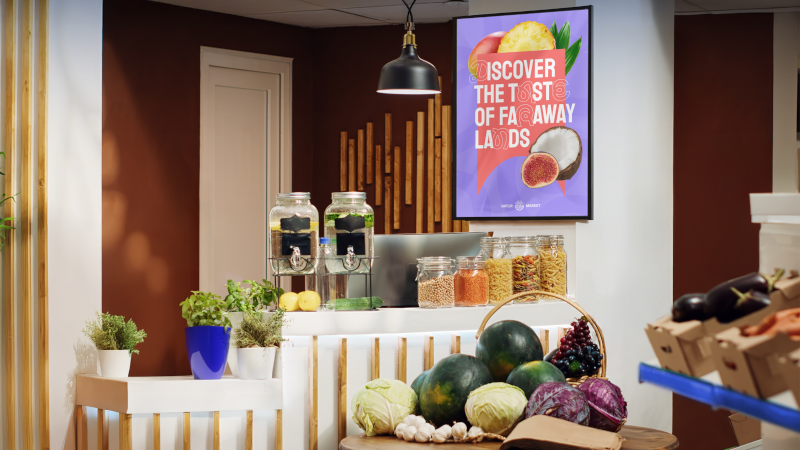 Retail food area with a colorful fruit promotion poster on the wall