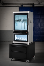 UltiMaker Factor 4 Plus industrial 3D printer shown with optional printer station